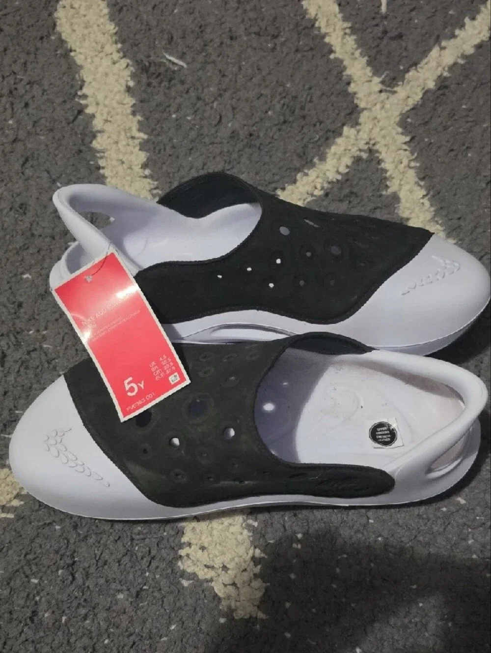Nike Kids Black and White Slip-On Sandals with Perforated Upper